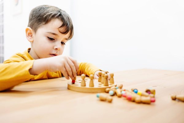 Provide daily care and therapy assistance for a child with autism, including structured activities, sensory play, and communication development.